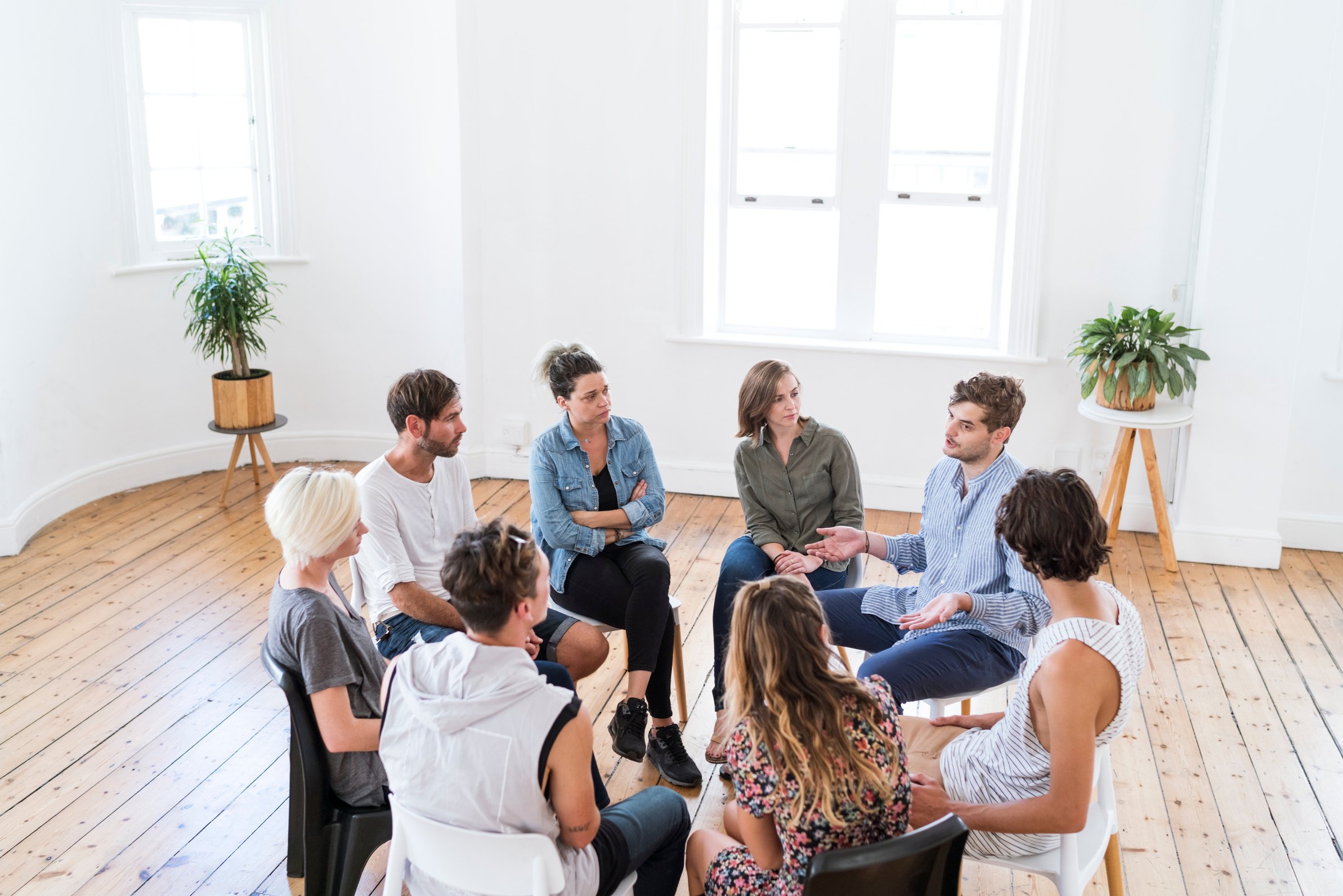 Man talking in group therapy session